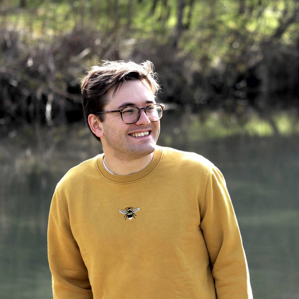 A photo of Oliver in a yellow sweater